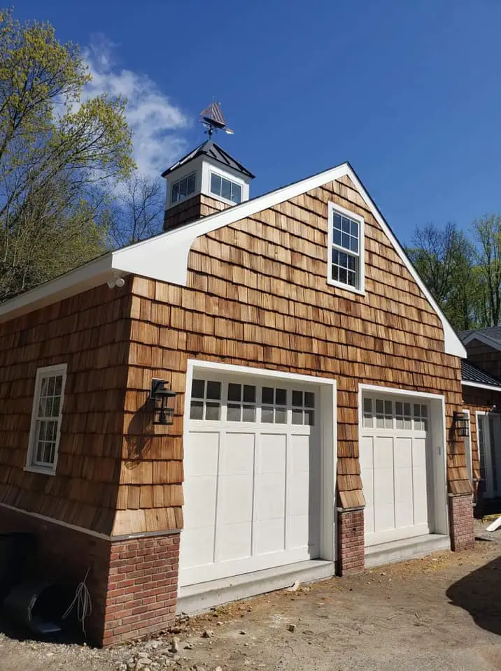 a house with a weather vane on top of it